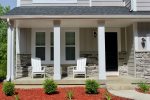Beautiful Porch Space with two Adirondack Chairs Perfect for Enjoying your Morning Coffee